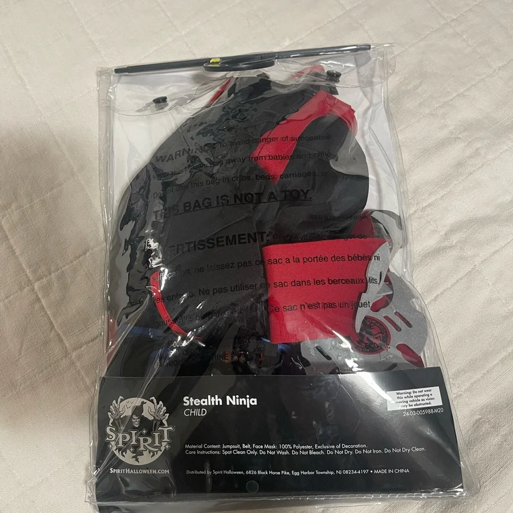 Stealth ninja jumpsuit with attached hood and tie size medium 8-10